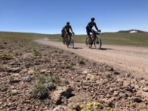two cyclists biking Steens Mountain gravel roads
