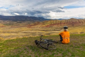 cyclist looking at Painted Hills