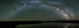 The Milky Way is reflected in a pool in Oregon's High Desert.