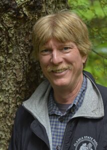 Image of Jim Stratton in front of a tree