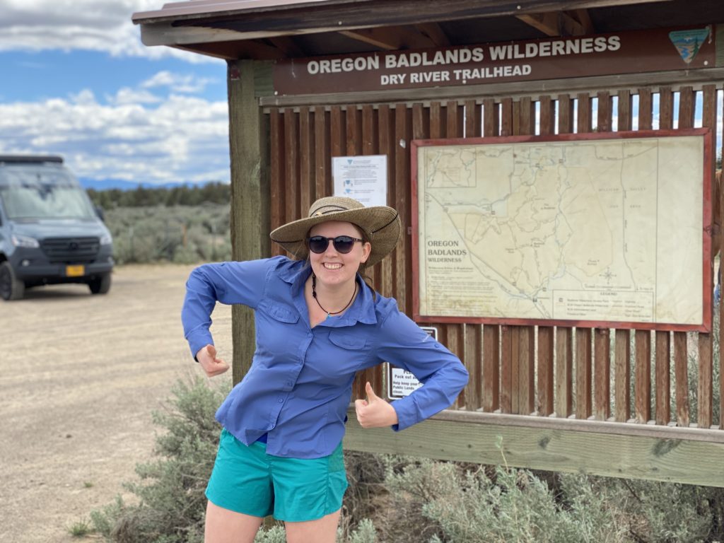 Oregon Desert Trail thru-hiker Carly Swisher at Oregon Badlands terminus