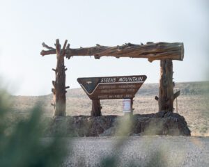 A Steens Mountain interpretive sign indicates cooperative management and protection area private and public lands